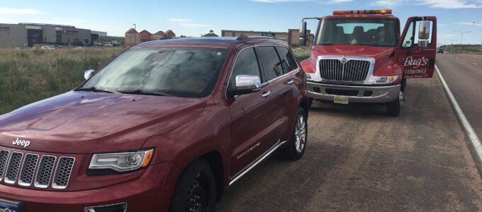 Roadside Assistance with car stuck on side of road