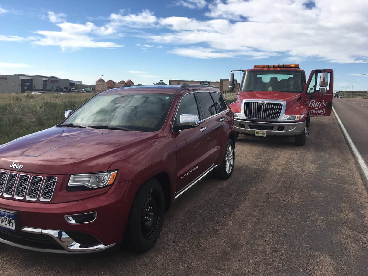 Roadside Assistance with car stuck on side of road